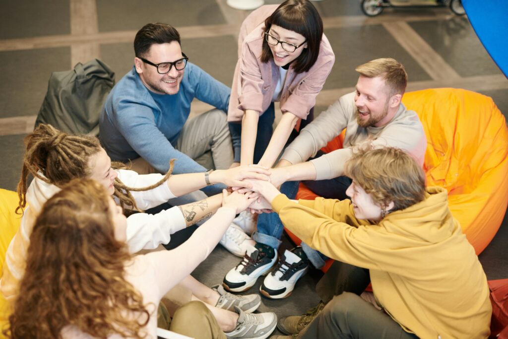 Photo of people holding each other s hands