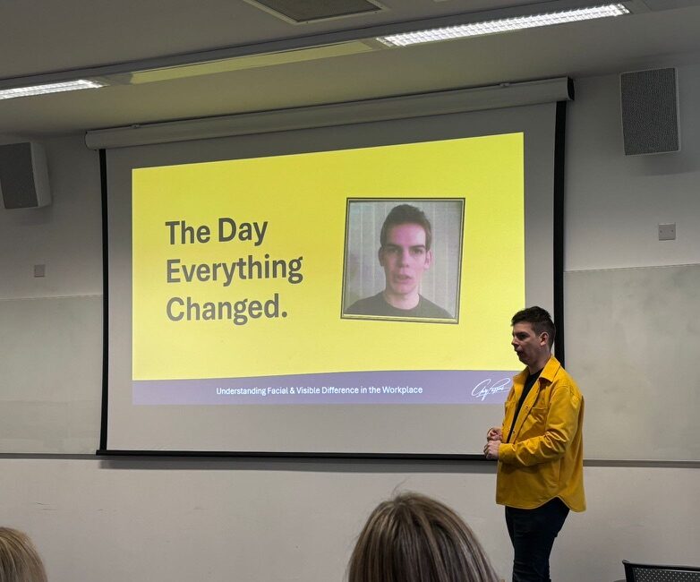 Gary Parsons presenting a talk about visible difference at a DEI Conference