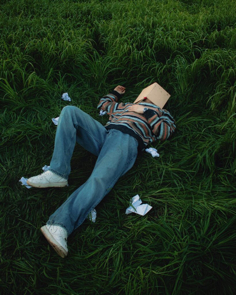 A person lying with a book