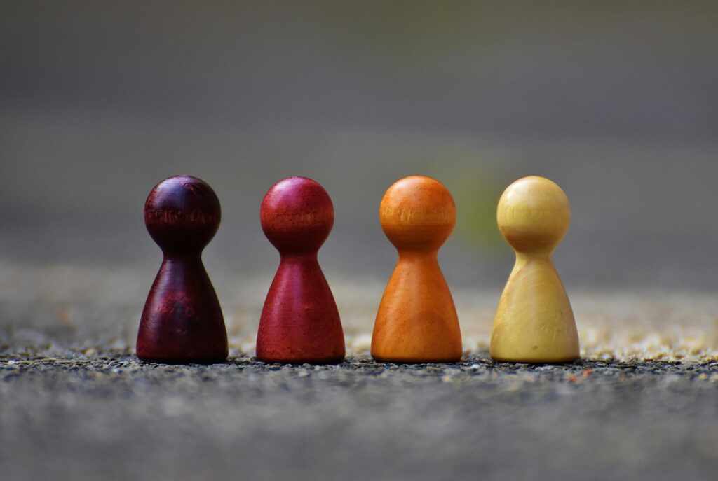 Focus photo of 4 wooden pawn figurine