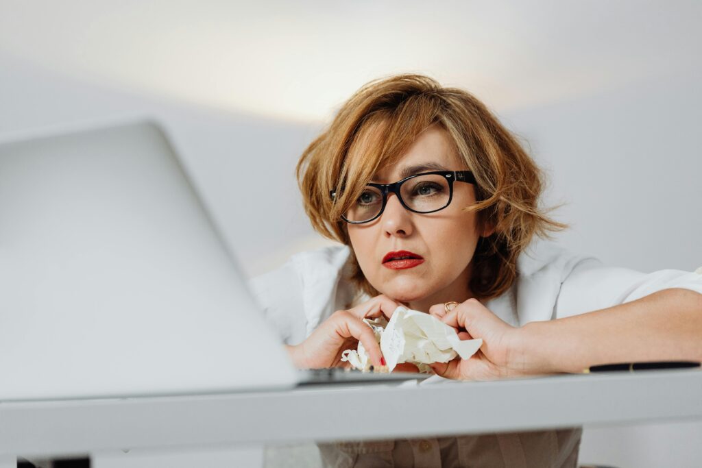 a leader sitting looking stressed at their desk